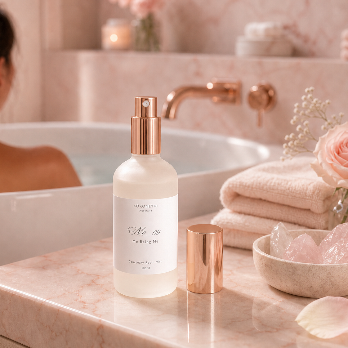 Bottle of Kokoneyui product on a bathroom counter with a woman in the background.