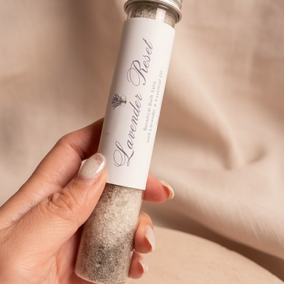 Hand holding a tube of &