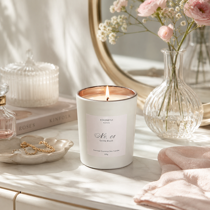 Candle on a table with flowers and decorative items in the background