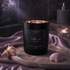 Black candle labeled &