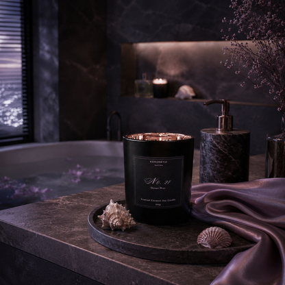 Candle on a tray with seashells in a relaxing setting