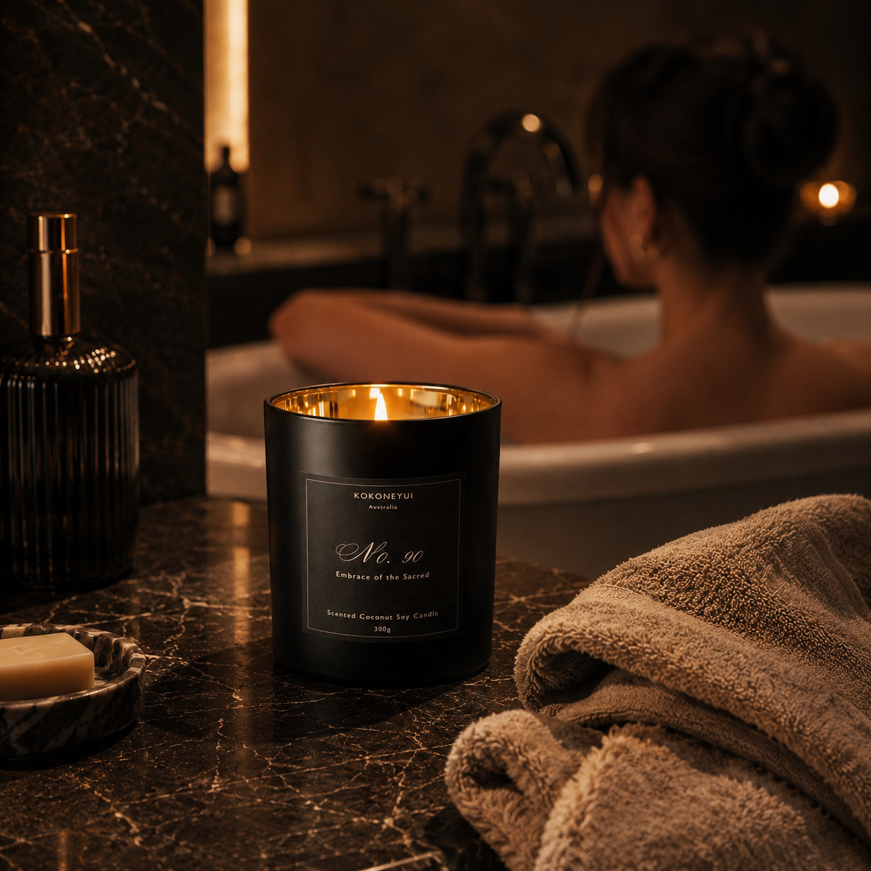 Woman in a bathtub with a candle and towel on a counter