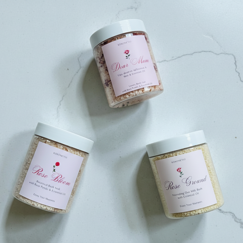 Three jars of bath salts with labels on a light marble background