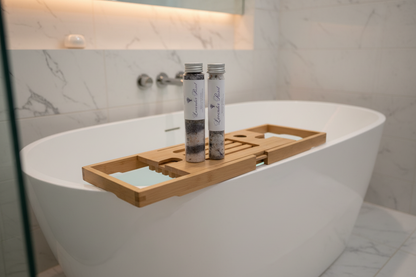 Two tubes of Lavender Reset bath salts on a marble countertop.