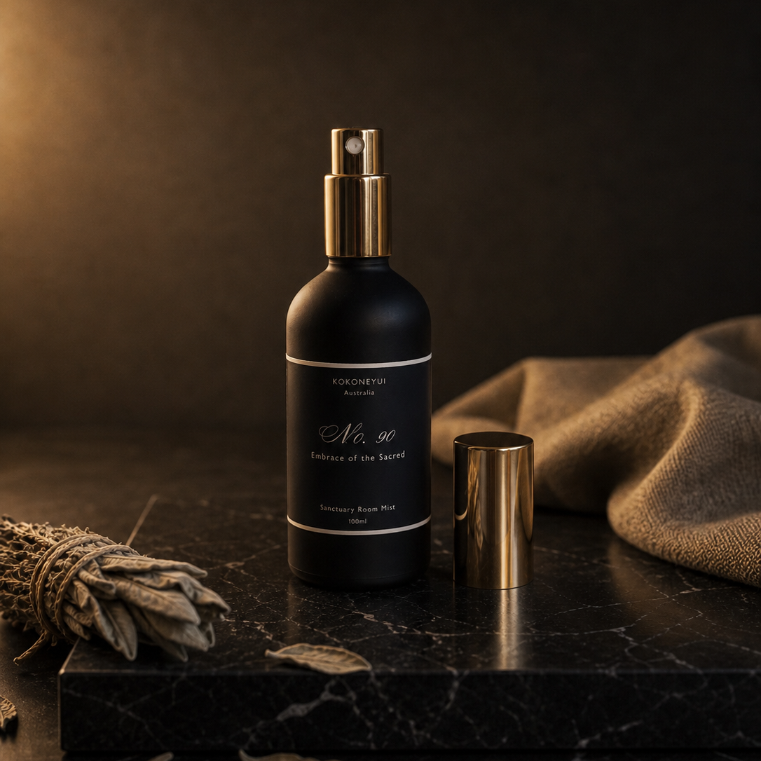 Black Mist bottle with gold cap on a dark surface with a brown background